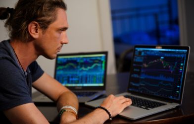 Millennial man investing in stock market