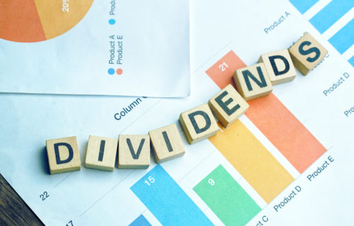 Dividends spelled out using wooden blocks
