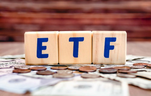 Wooden cubes with blue letters forming the word ETF (Exchange Trade Funds) letters