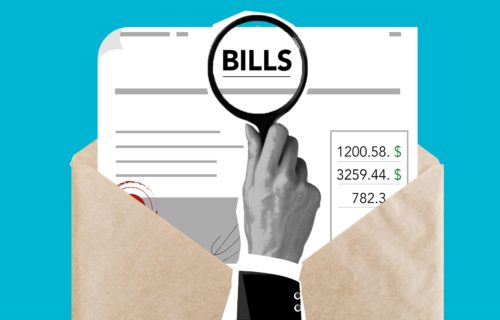 Bills and debt concept: Magnifying glass over "Bills" in envelope