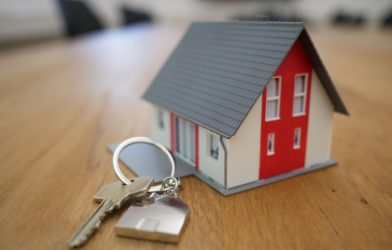 Buying a home: House keychain with keys on it