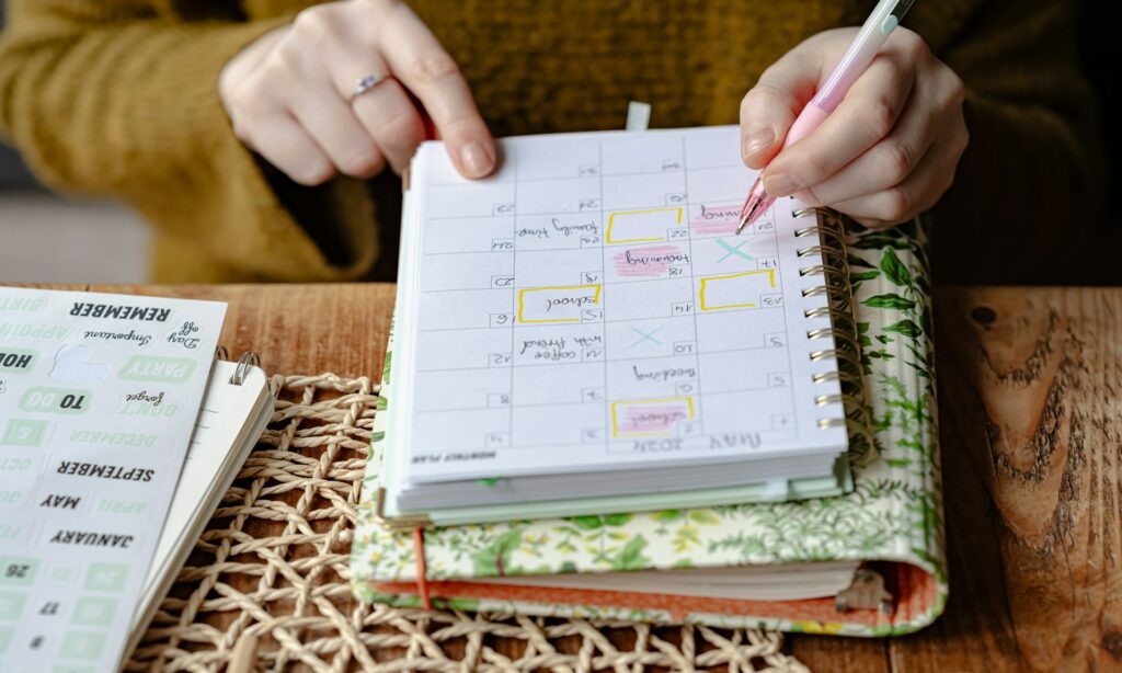 Woman writing in her calendar planner